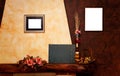 Two empty frames, and blackboard on yellow and brown wall Royalty Free Stock Photo