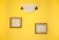 Two empty frames on yellow wall Royalty Free Stock Photo