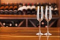 Two empty glasses in background with bottles of wine Royalty Free Stock Photo