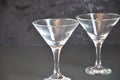 Two empty glasses for making margarita cocktails with lime on a black background Margarita cocktails shot on a bar