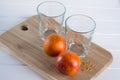 Two empty glasses and Sicilian oranges