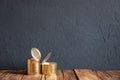 Two empty Golden tin cans on the wooden table. The grunge style Royalty Free Stock Photo