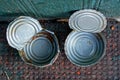 Two empty open dirty tin cans on the table Royalty Free Stock Photo