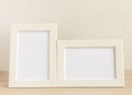 Two empty photo frames on a table or shelf with a copy of the space Royalty Free Stock Photo