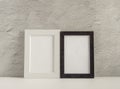 Two empty photo frames on a table or shelf with a copy of the space Royalty Free Stock Photo