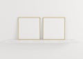 Double 10x10 Square Gold Frame mockup on marble shelf and white wall