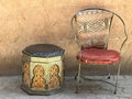 Two empty, quirky, worn metallic chairs in street, Marrakech, Morocco Royalty Free Stock Photo