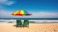 Two empty seats under a multicolored rainbow umbrella