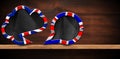 Two Empty Speech Bubbles with UK Flag on a Wooden Shelf Royalty Free Stock Photo