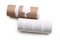 Two empty toilet rolls in bathroom on white background