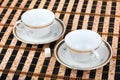 Two empty white porcelain cup on the table Royalty Free Stock Photo