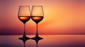 Two empty wine glasses on a reflective dark surface with copy space Royalty Free Stock Photo