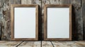 Two empty wooden frames placed on a rustic wooden table ready for photos or artwork Royalty Free Stock Photo