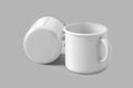 Two enamel coffee cups or mugs mockup with copy space for logo isolated over a grey background with clipping path included.