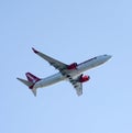 Two engine passenger jet seen from below the fuselage