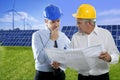 Two engineer architect plan hardhat solar plates Royalty Free Stock Photo