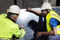 Two  Engineer Discussing and Checking Solar Panels Royalty Free Stock Photo