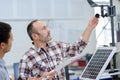 two engineer or installer inspecting solar energy panels Royalty Free Stock Photo