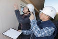 Two engineer showing foreman building plan