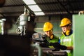 Manual workers cooperating while measuring a electronic