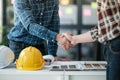 Two engineering man with construction worker greeting a foreman at renovating apartment. Royalty Free Stock Photo