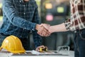 Two engineering man with construction worker greeting a foreman at renovating apartment. Royalty Free Stock Photo