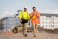 Two engineers. Architect at a construction site. Handyman builders in hardhat. Building concept. Builder foreman. Two Royalty Free Stock Photo