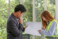 Two engineers discussing work in meeting room at the office. Eng Royalty Free Stock Photo