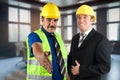 Two engineers with helmets Royalty Free Stock Photo