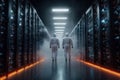 Engineers in Protective Suits Inspecting High-Tech Data Center Server Room with Fog and Modern Lighting Royalty Free Stock Photo