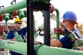 Two engineers working inside oil and gas refinery Royalty Free Stock Photo