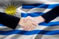 Two entrepreneurs and Uruguay flag