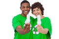 Two environmental activists holding energy saving light bulbs Royalty Free Stock Photo