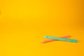 Two erasable pens on yellow background. Space for text Royalty Free Stock Photo