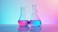Two erlenmeyer flasks filled with vibrant pink and blue liquids, illuminated against a gradient background reflecting a modern Royalty Free Stock Photo
