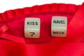 Two erotic dice for sexual game couple relation on red satin background texture isolated on white background top view with the Royalty Free Stock Photo