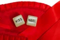 Two erotic dice for sexual game couple relation on red satin background texture isolated on white background top view with the Royalty Free Stock Photo