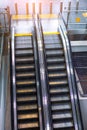 Two escalator stairs up and down to different floors of the building Royalty Free Stock Photo