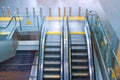 Two escalator stairs up and down to different floors of the building Royalty Free Stock Photo