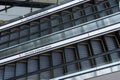 Two escalators in the foreground with a sign in Spanish that says avoid going in the opposite direction Royalty Free Stock Photo