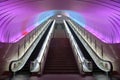 Two Escalators with Pink Light overhead