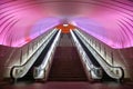 Two Escalators with Pink Light overhead