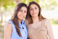 Two Ethnic Twin Sisters Portrait Outdoors.