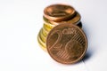 Two Euro cents on a white background at the stack of coins, European metal Royalty Free Stock Photo