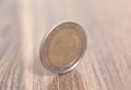 Two euro coin on a wooden surface Royalty Free Stock Photo