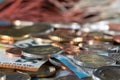 2, two euro coins and difference coins on top of fifty euro and 20 euro bill. coins out of focus in the background Royalty Free Stock Photo