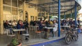 Two european girls are drinking coffee at man`s coffee bar in Tunisia.