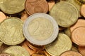 Two Euros coin on top of a pile of other coins Royalty Free Stock Photo