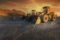 Two excavators moving stone and rock in a quarry Royalty Free Stock Photo