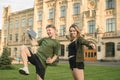 Two excited students with approved exams in the street feeling satisfied, happy and proud. Cheerful students couple celebrating